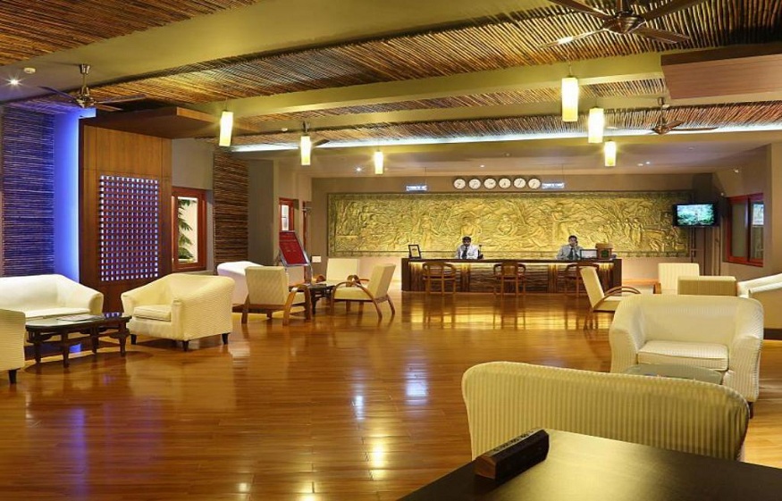 What attracts people to stay at the Vythiri Village Resort?